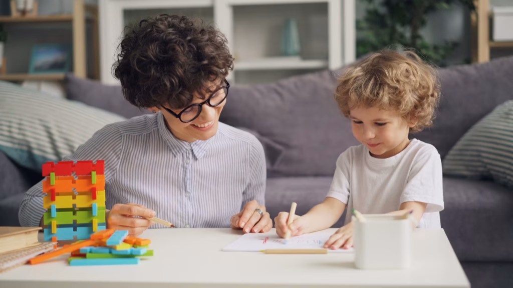 Women helping young child regulate their emotions